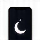 Ein Symbol für ein Smartphone mit ausgeschaltetem Bildschirm und einem Mondsymbol.